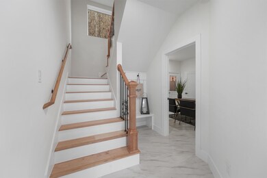 As you step into your bright, modern entryway with
