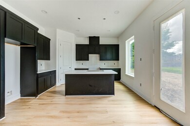 The kitchen has quartz countertops and will have a