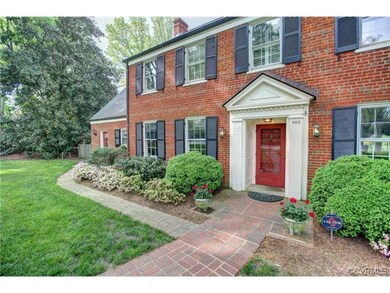 Recessed paneled entry with fluted columns and dec