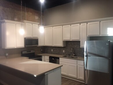 Kitchen with appliances with stainless steel finis