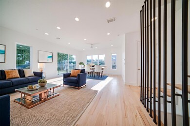 Living room with light hardwood / wood-style floor