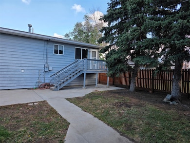 Rear view of house featuring stairs