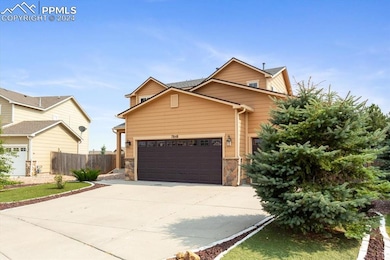 View of front of home featuring a garage