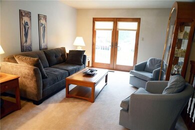 Spacious living room with double doors to a deck! 