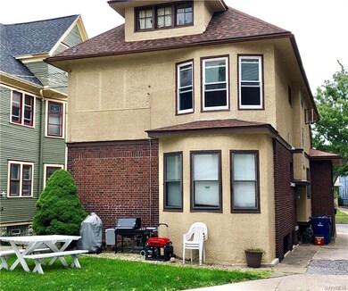 Back of house. Yard and grill for tenants' use.