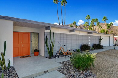FRONT OF HOUSE WITH BICYCLE TO MOUNTAINS