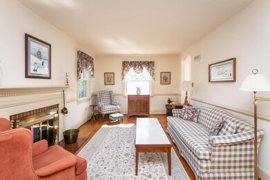 The cozy living room features fireplace and access