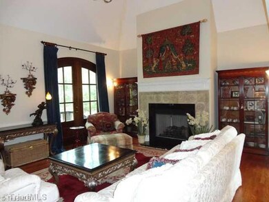Living Room. French cathedral ceiling is a vocal point of this spacious living room