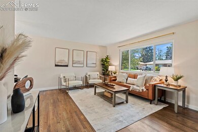 Living area with wood finished floors and baseboards