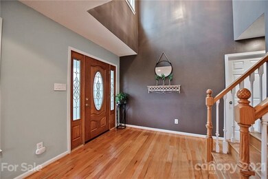  Two story foyer and beautiful hardwoods.