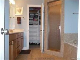 Large master bath with custom shelving in the larg