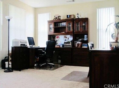 Formal Living Room currently used as an office/stu