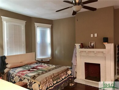Front room with decorative fireplace.