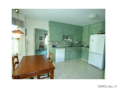 Kitchen. Bay wall is perfect setting for kitchen t