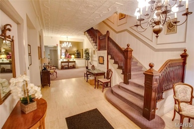Building lobby featuring an ornate ceiling and stairs