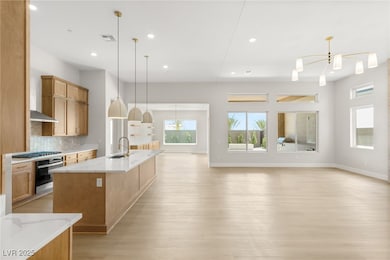 Kitchen with light wood-style flooring, a sink, vi