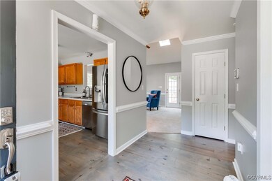 Interior space featuring hardwood flooring, crown