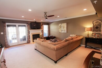 First floor rec room with fireplace, access to dec
