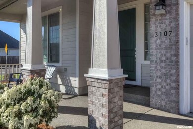 This lovely Craftsman style front porch welcomes y