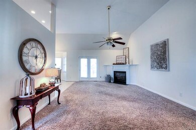 Family Room with Vaulted Ceilings and Ceiling Fan