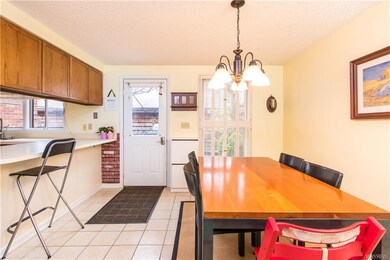 Dining area measuring 13 x 10 with bisque-colored 