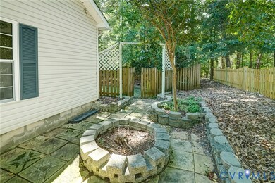 Fenced backyard with an outdoor fire pit