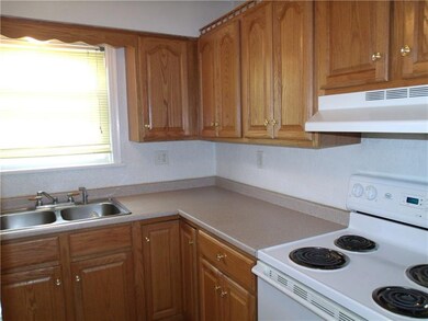 Oak Kitchen Cabinets, Double Bowl Sink and electri