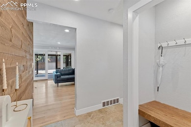 Functional entry with wood bench and coat storage