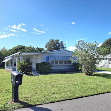View of front of property featuring a front yard and a porch