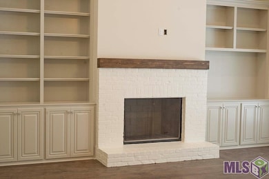 Painted brick with cypress mantel, surrounded by c