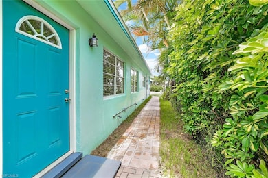 Entrance to property with stucco siding