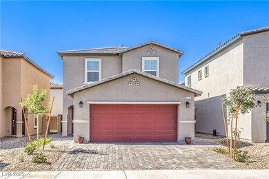 View of front of house with decorative driveway, s