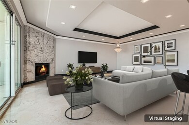 Living room with a raised ceiling, recessed lighti