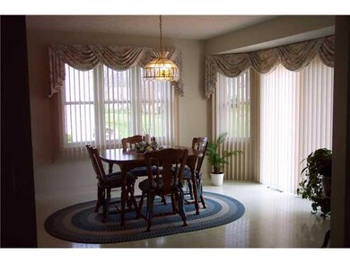 Dining Room. Dining area with bay window and door 