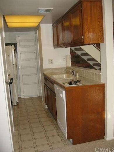 There is a second pantry at the end of the kitchen
