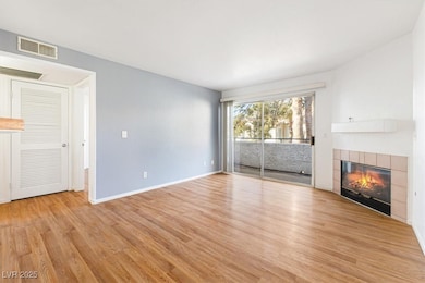 Unfurnished living room with visible vents, basebo