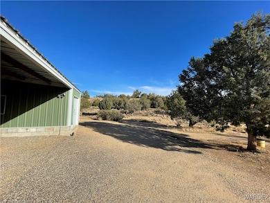 Garage offering 3 carport cover area & 1 car enclo