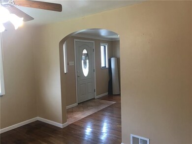 Archway between living room and dining room.