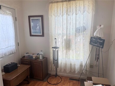 Enclosed front porch makes great sun room or exten