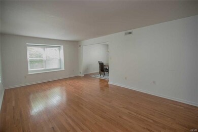 Living room with hardwood floors and window seat
