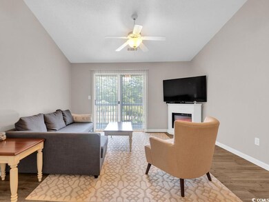 Living room with lofted ceiling, ceiling fan, and 