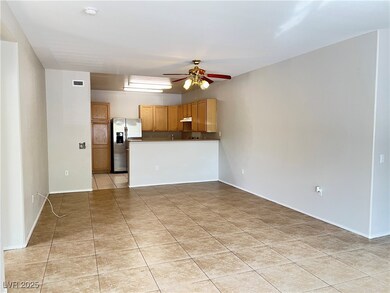 Kitchen featuring stainless steel fridge, a penins