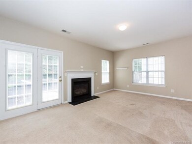 Great room fireplace and entrance to deck