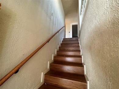 Staircase with a textured wall