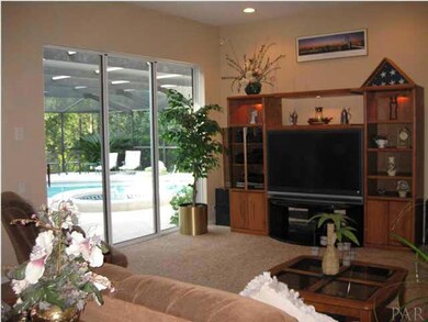 Take a look at the leisure room and its wall of sliding glass to the pool area.