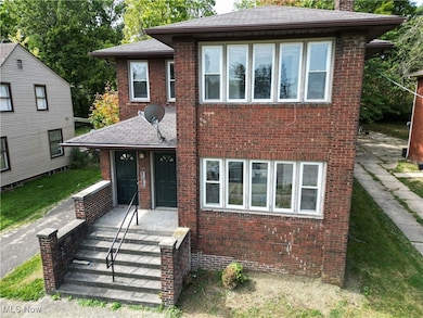 View of front facade featuring brick siding