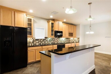 22 x 10 kitchen with granite countertops, breakfast bar, recessed lighting and eat-in nook.