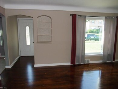 Another view of livingroom showing newe front door