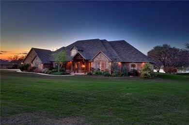 Stunning home is on the lake on 2.2 acres on only 