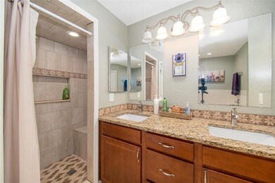 Master shower with built-in shower seat.
